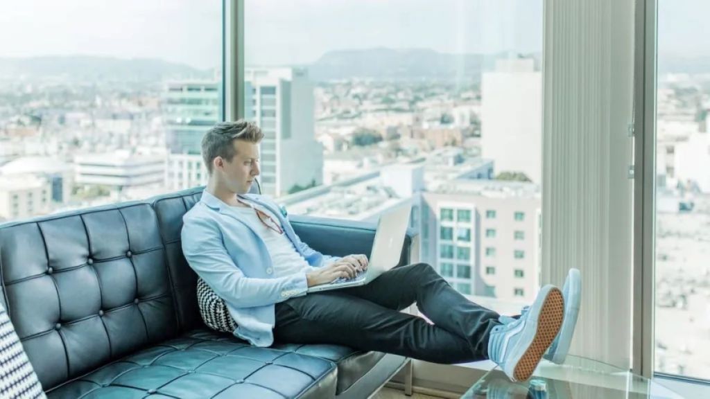 Person reviewing telephone interview results on a laptop.