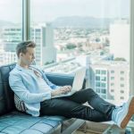 Person reviewing telephone interview results on a laptop.