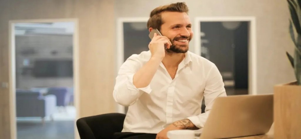 person using phone with VoIP