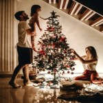 Family decorating a Christmas tree as a metaphor for goals setting