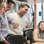 Group-of-people-looking-at-laptop