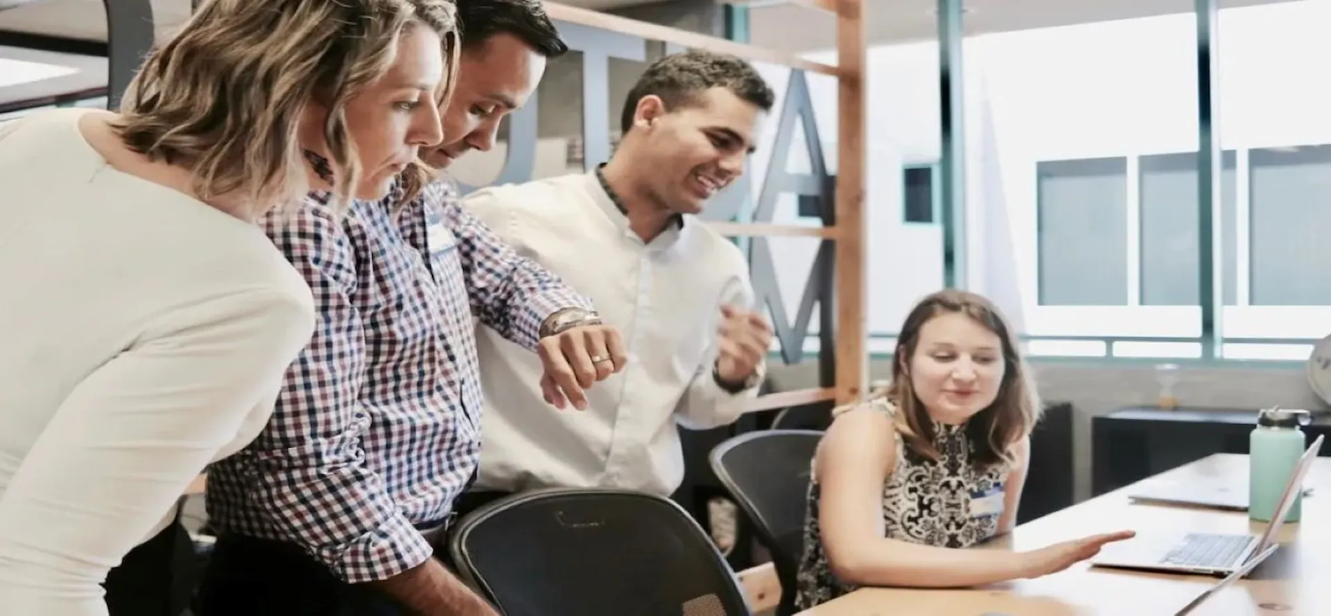 Group-of-people-looking-at-laptop