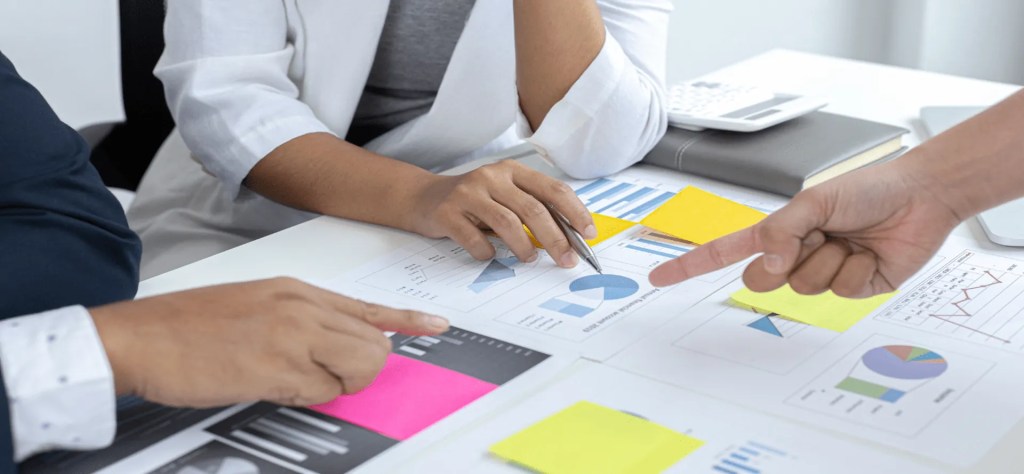 Group of people working on types of data