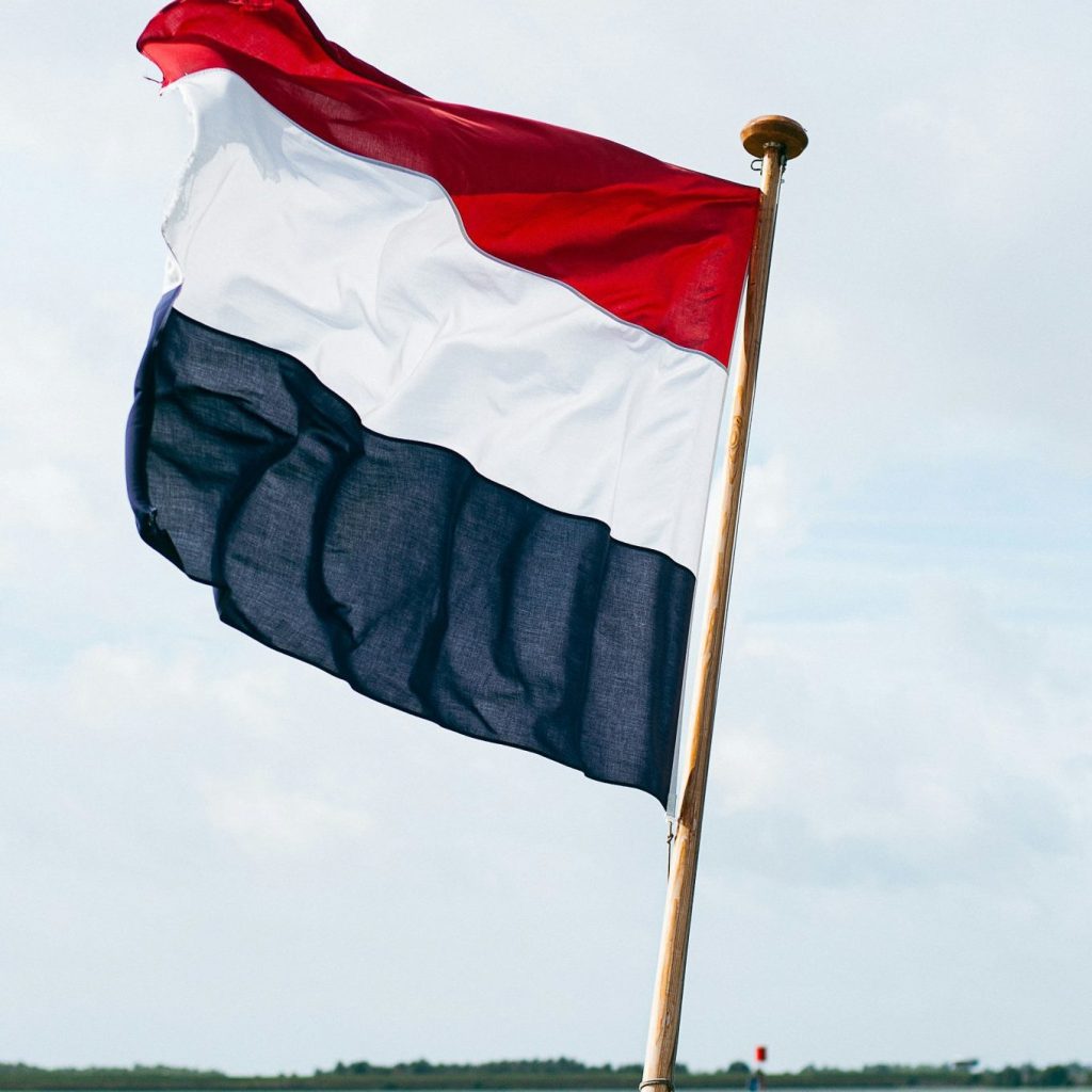 Dutch-speaking customer support representation with Netherlands flag
