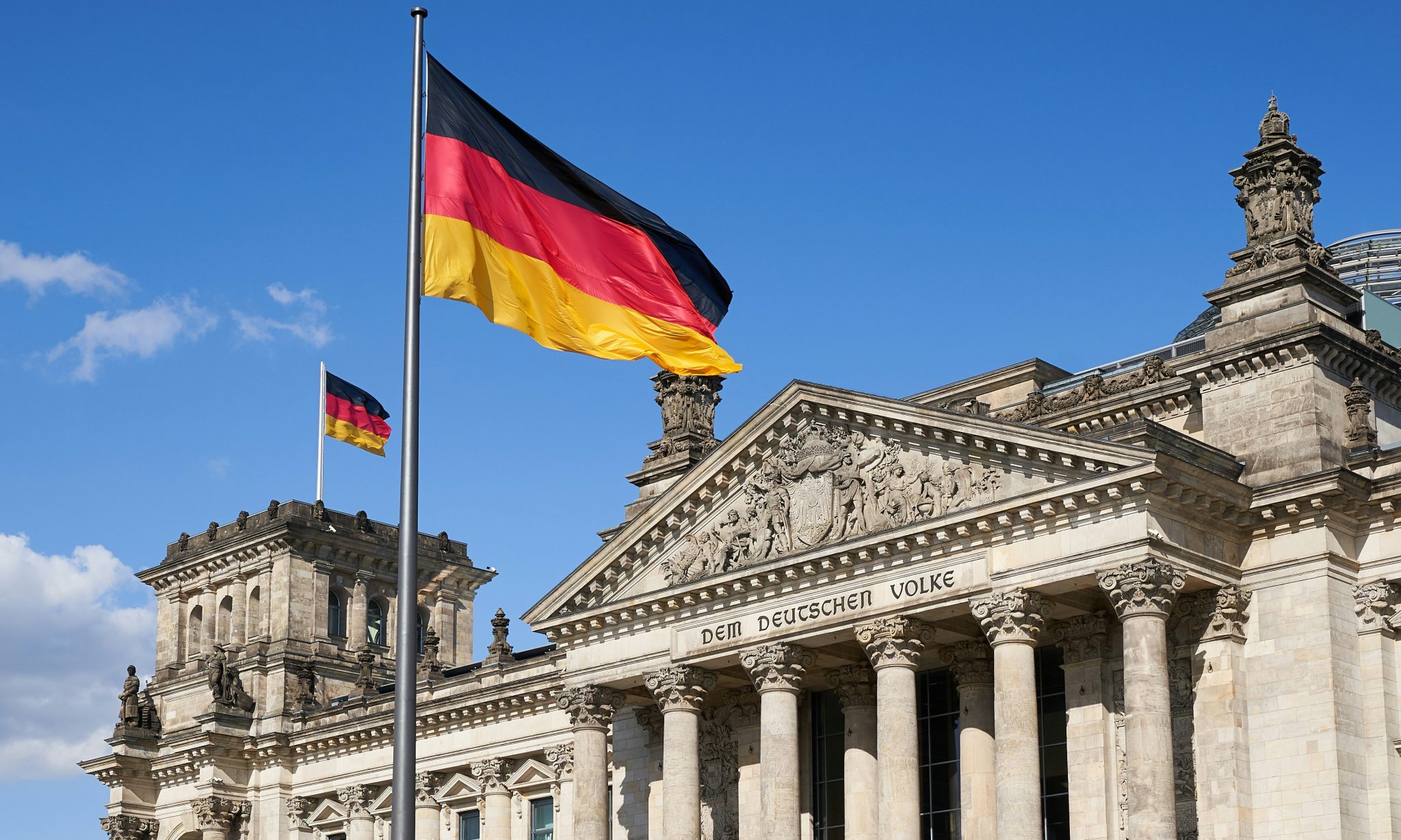 German-speaking customer support representation with German flag and Berlin architecture