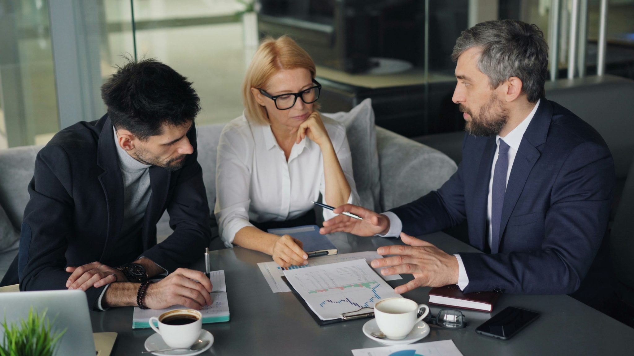 Business team analyzing market data during a meeting