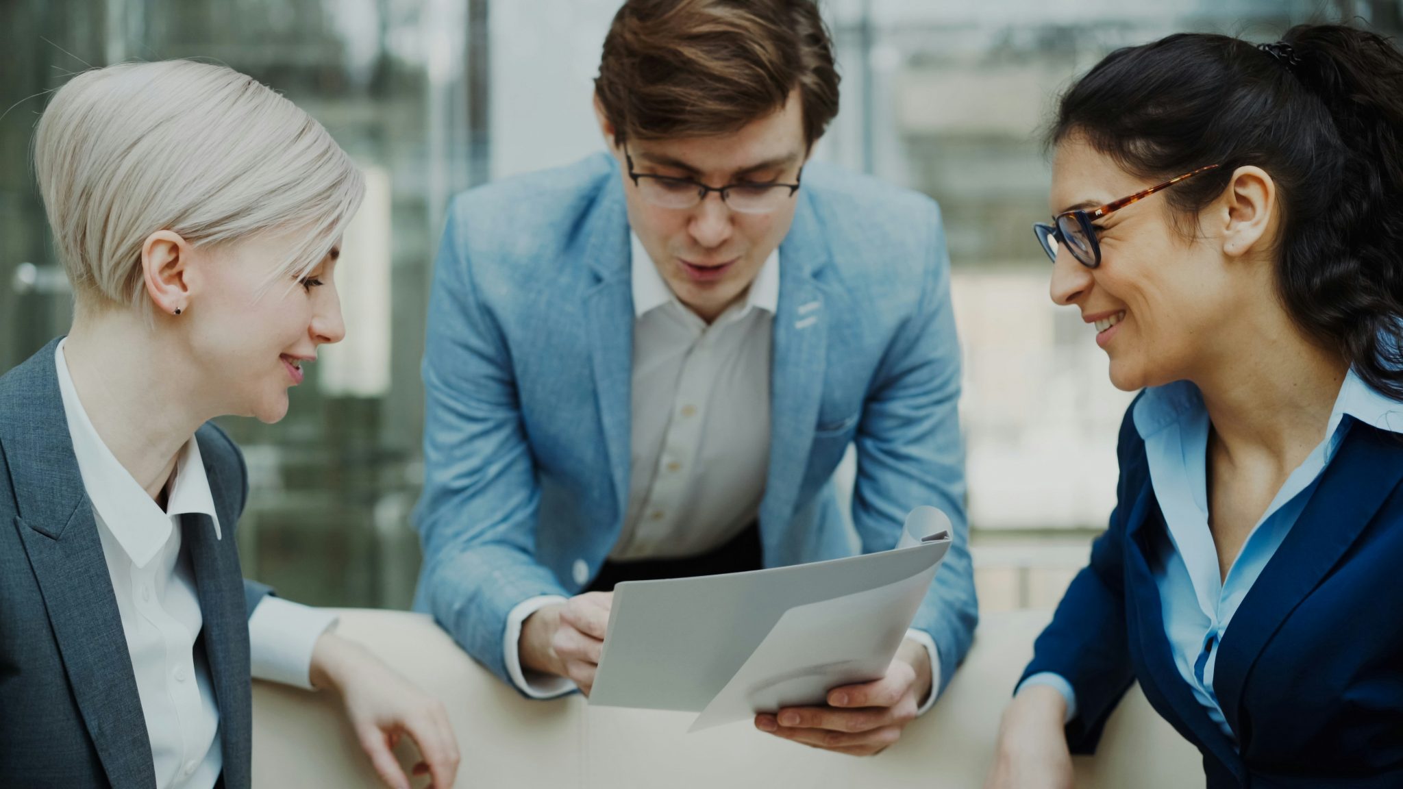 Business professionals reviewing competitor analysis data and strategic market insights during a meeting