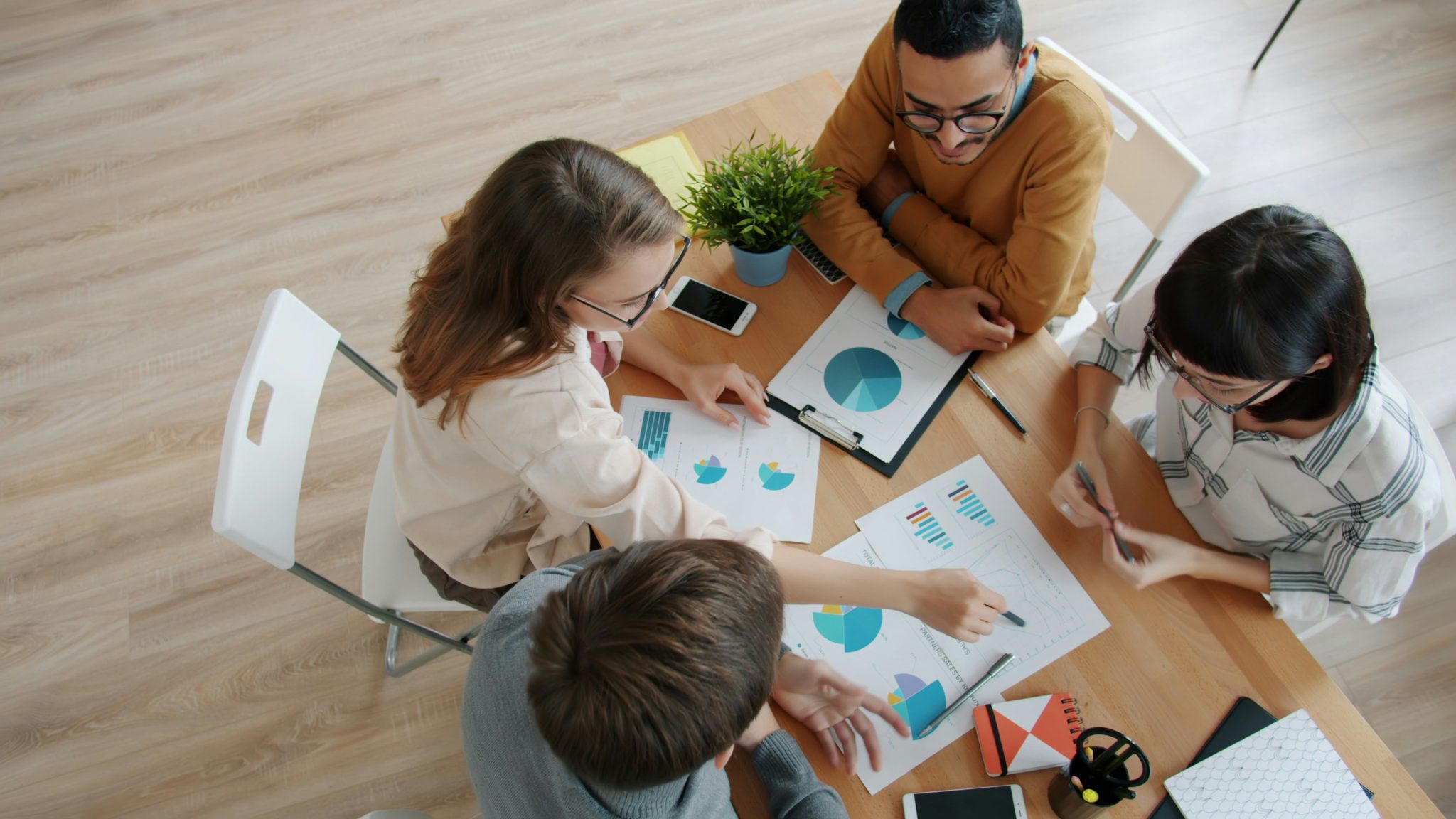 Team reviewing consumer research data and customer insights during a market research meeting