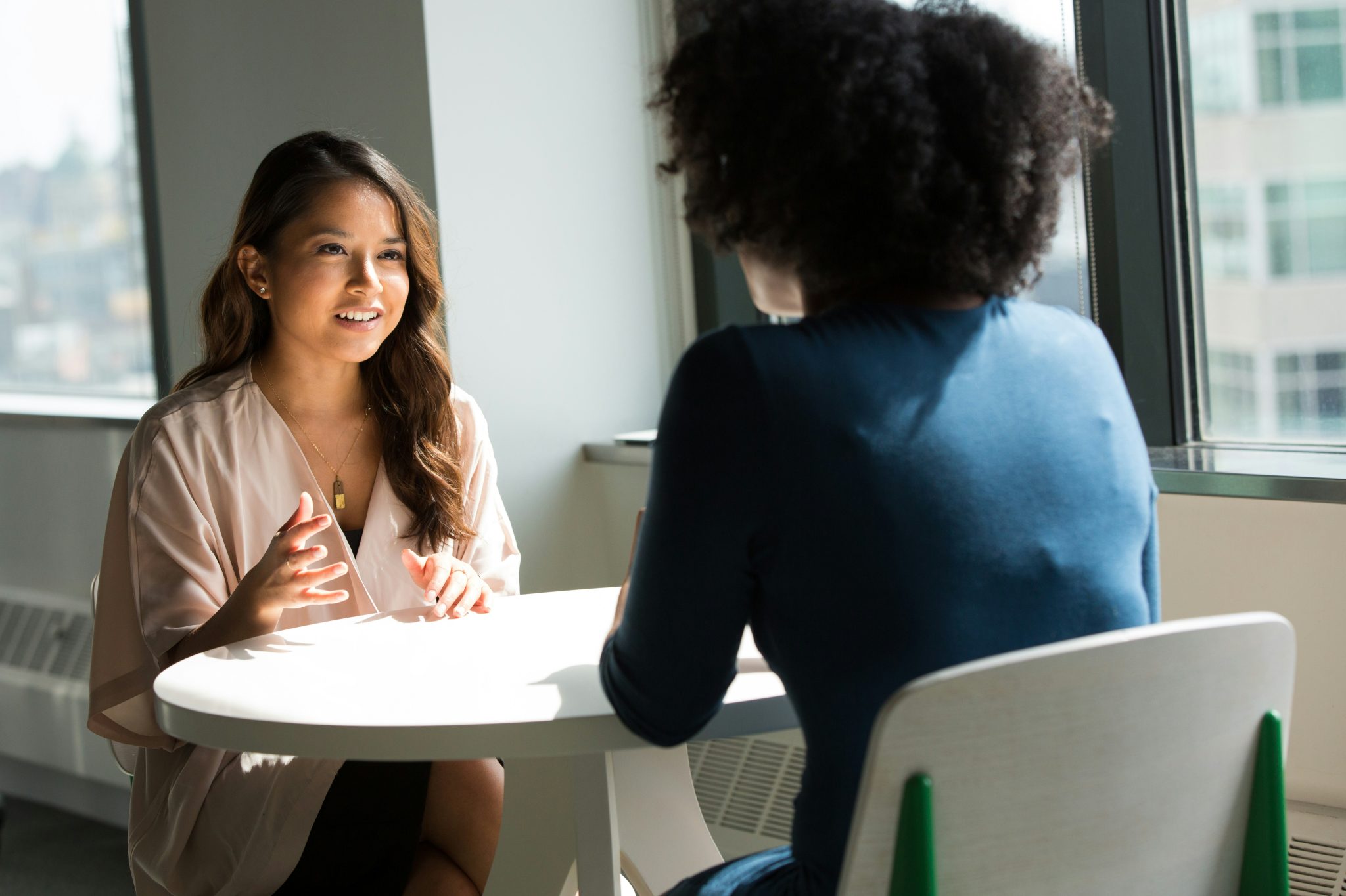 Multilingual recruitment interview between international candidates during a hiring meeting