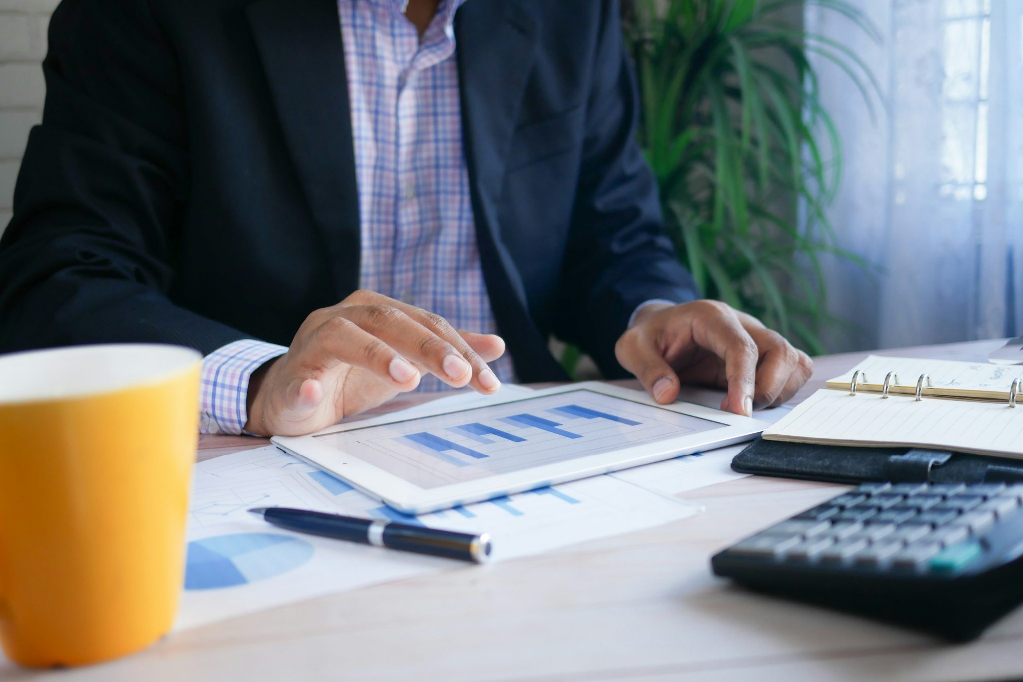 Business professional analyzing market research data and financial reports