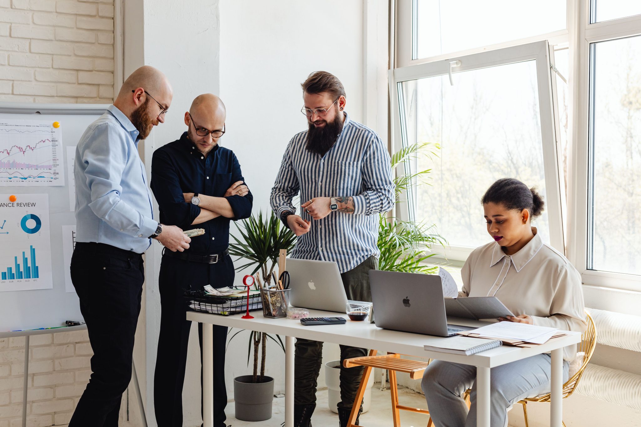 Business professionals collaborating on back office tasks, administrative support, data management, reporting, and operational processes in a modern office environment.