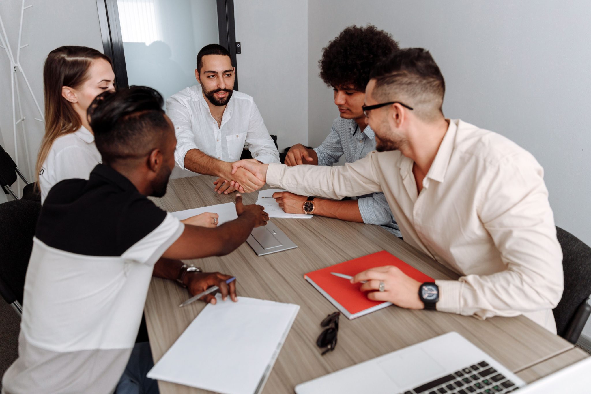 Business professionals collaborating in a meeting to support back office operations, administrative processes, workflow management, and business support services.