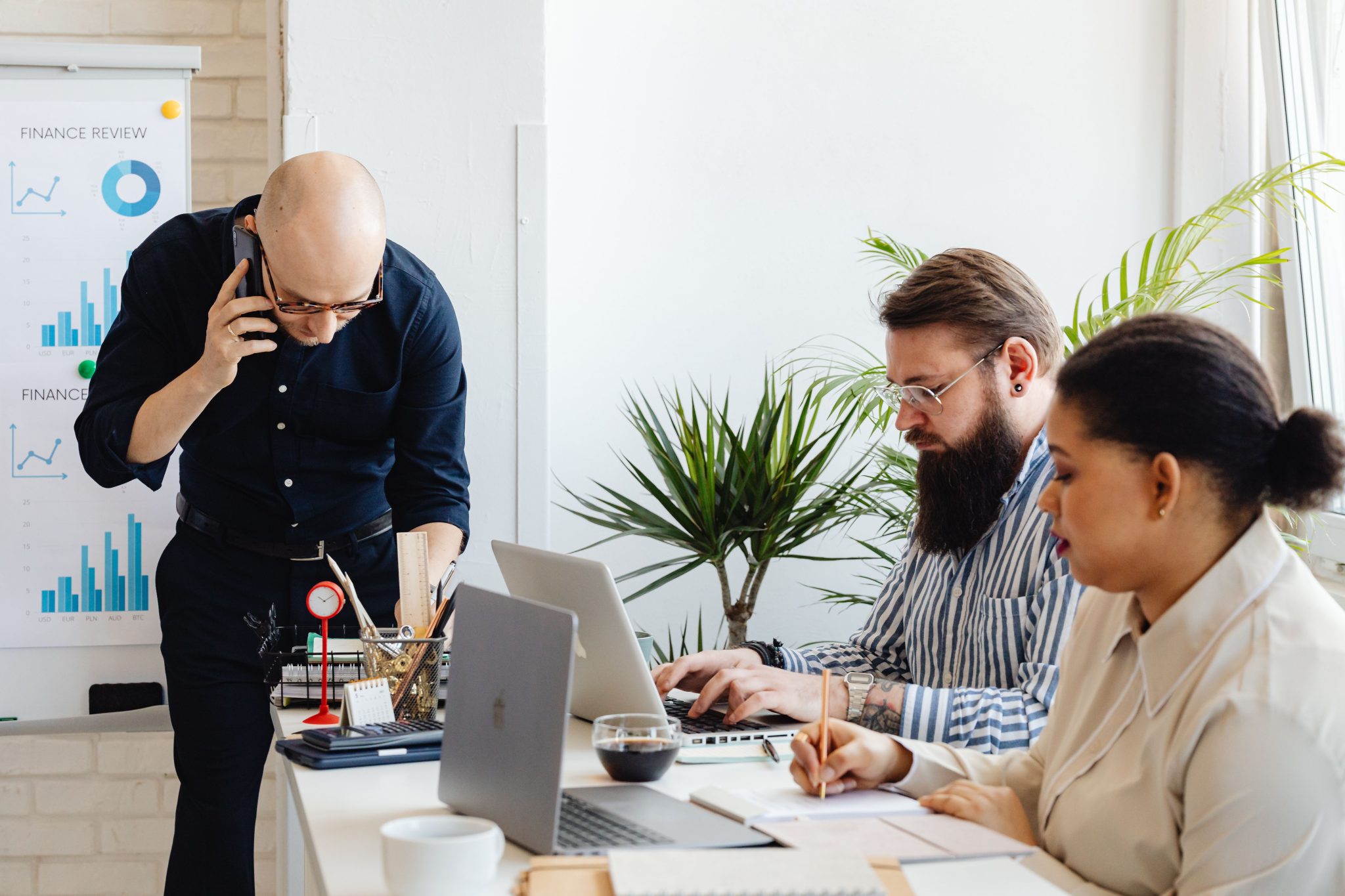 Business professionals collaborating on back office operations, administrative support, and workflow management in a modern office