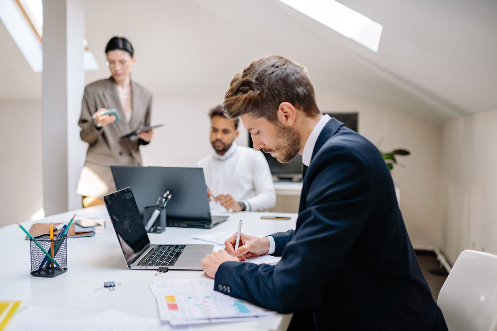 Professionals collaborating in a modern office environment at Katrium