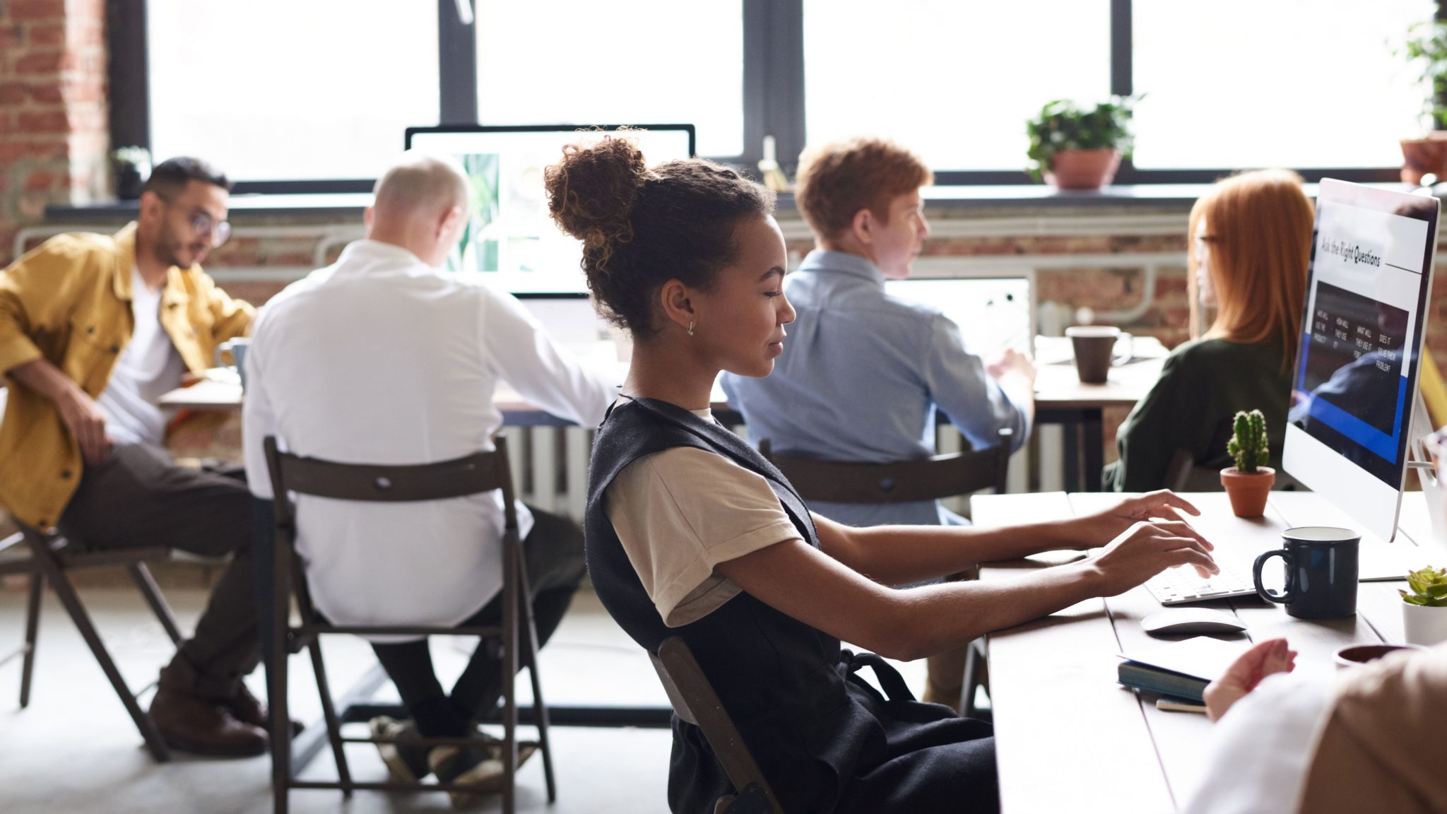 Business professionals performing data entry and managing digital records to support efficient data management and business operations