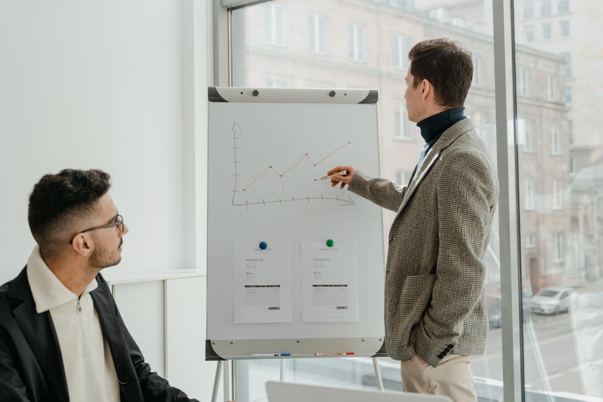 Business professional presenting sales pipeline performance and lead generation strategy during a team meeting.