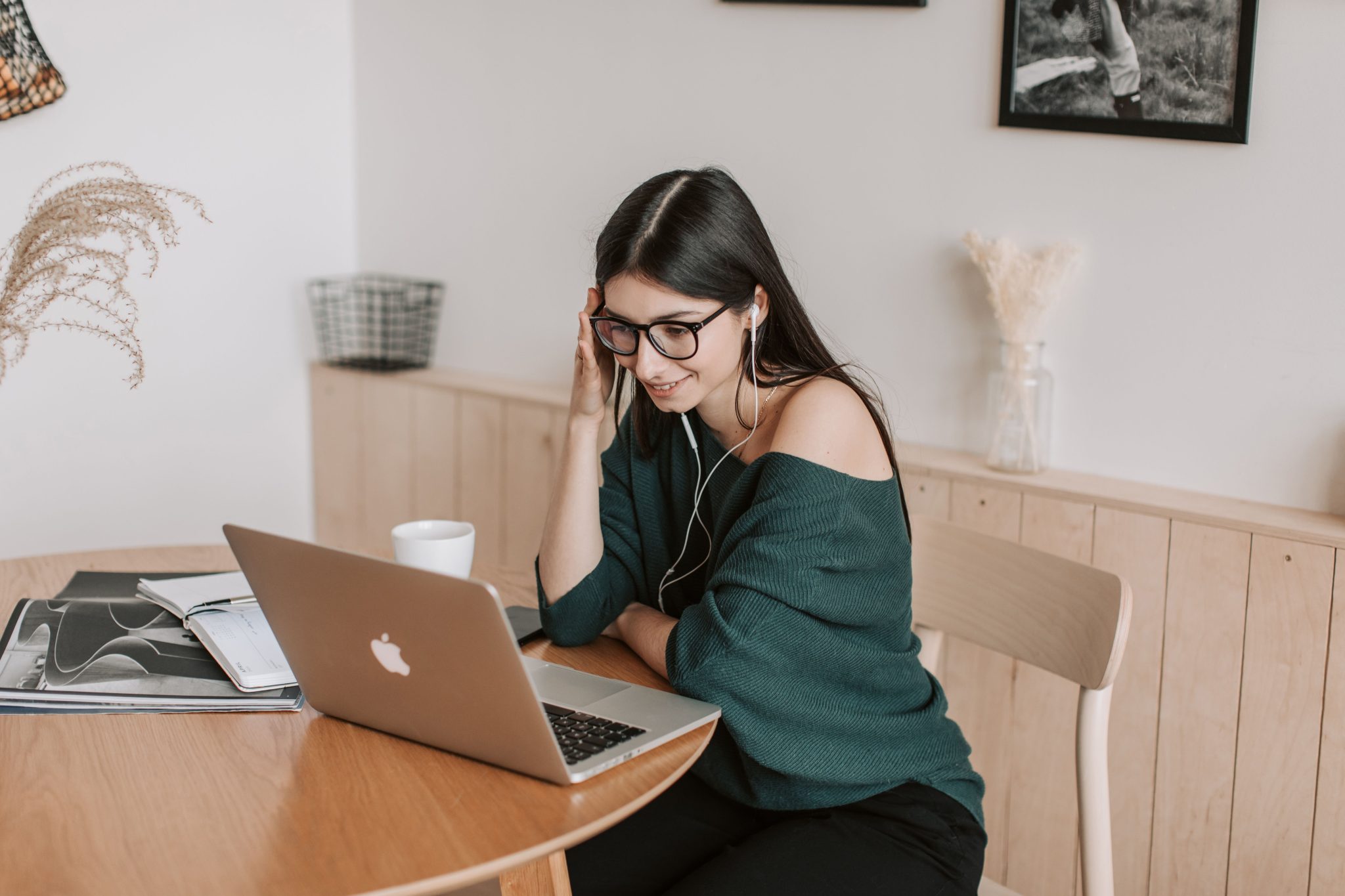 Virtual assistant providing remote administrative support and business assistance while working on a laptop.